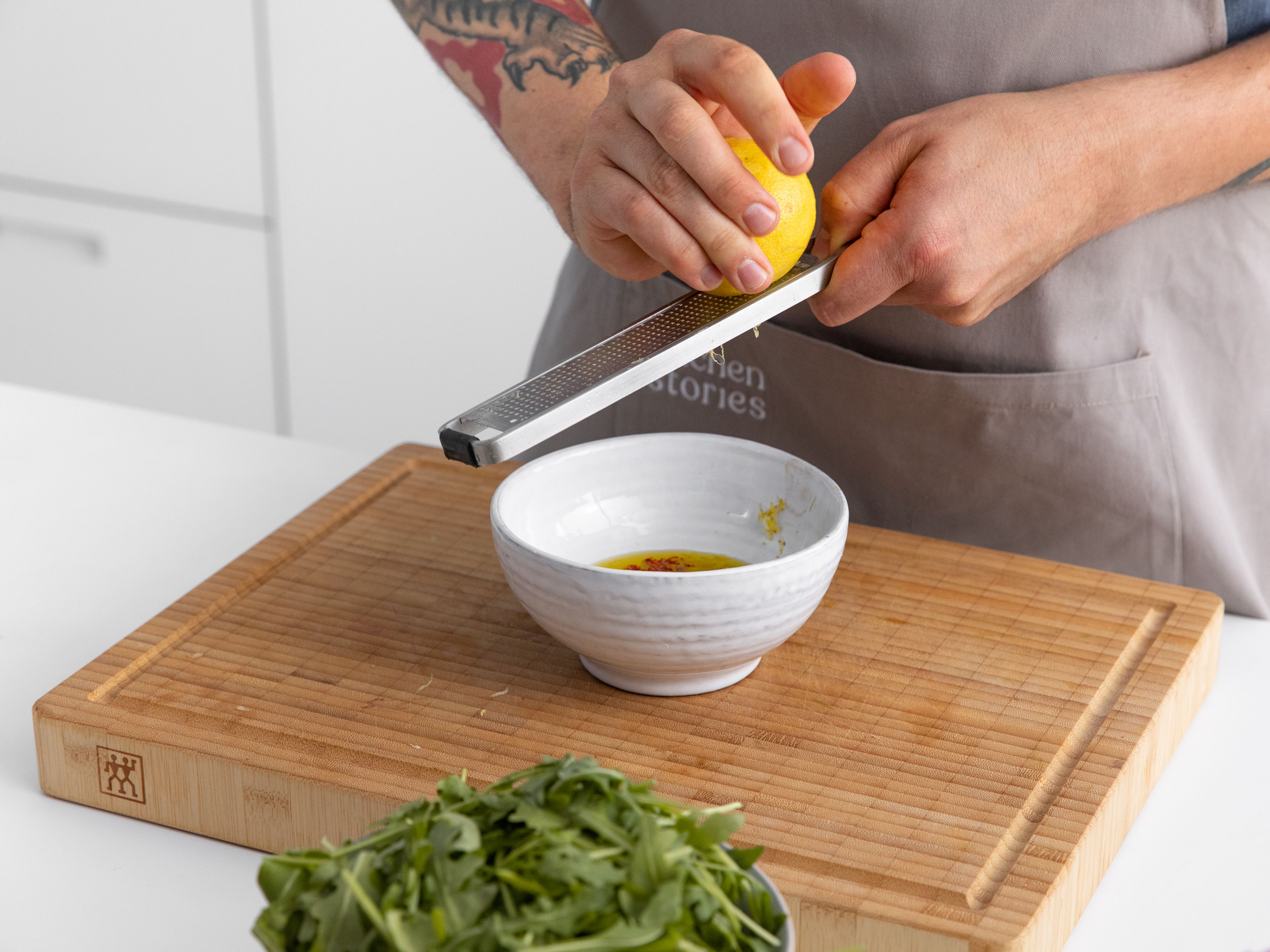 For the dressing, mix olive oil, chili flakes, lemon zest and juice, and mix to combine. Season with salt and pepper to taste.