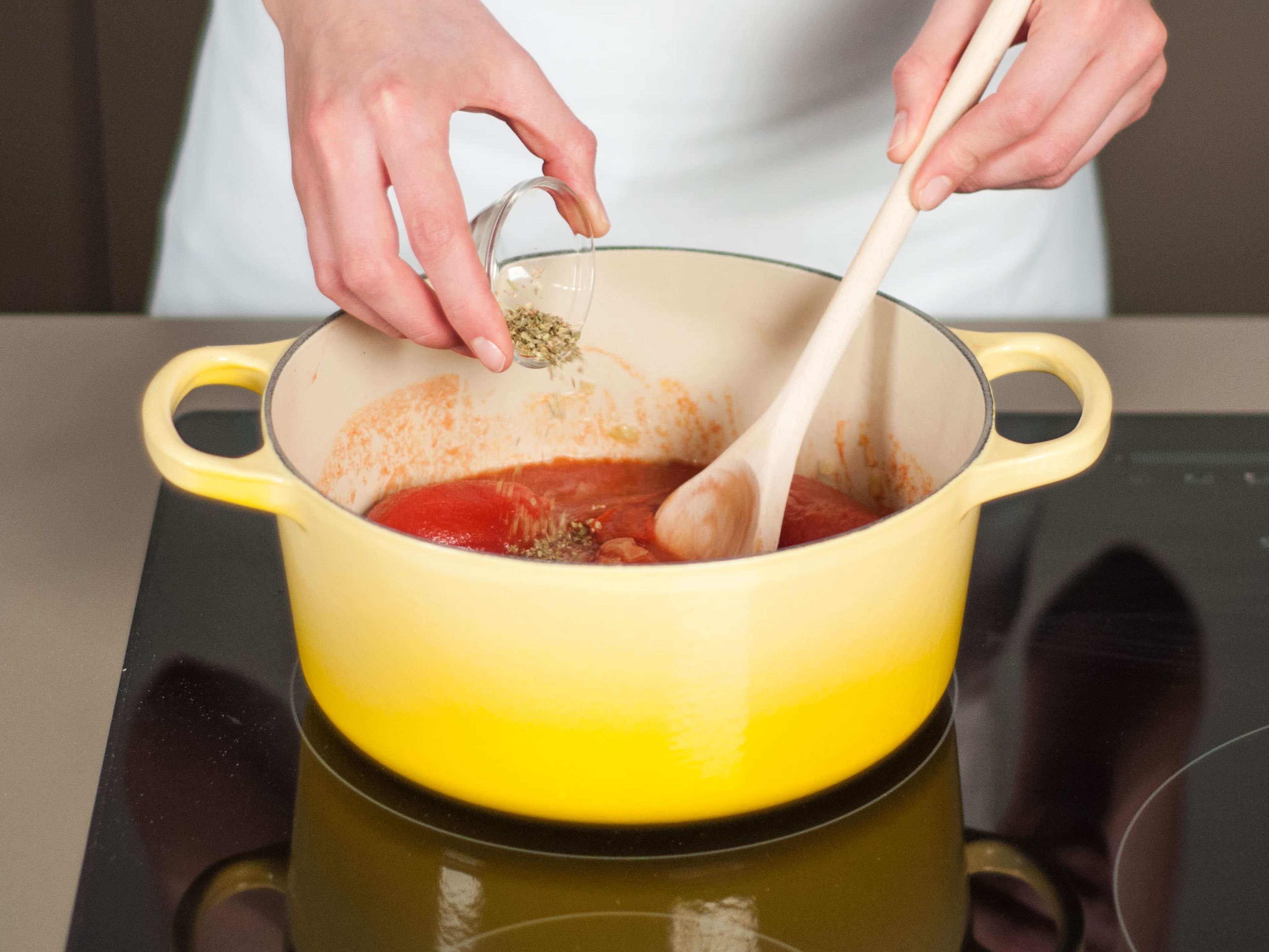 In a large saucepan, sauté onion in some vegetable oil over medium heat for approx. 3 – 4 min. until translucent. Add tomatoes and oregano to pan and cook for approx. 8 – 10 min. until sauce begins to thicken. Season with salt and pepper.