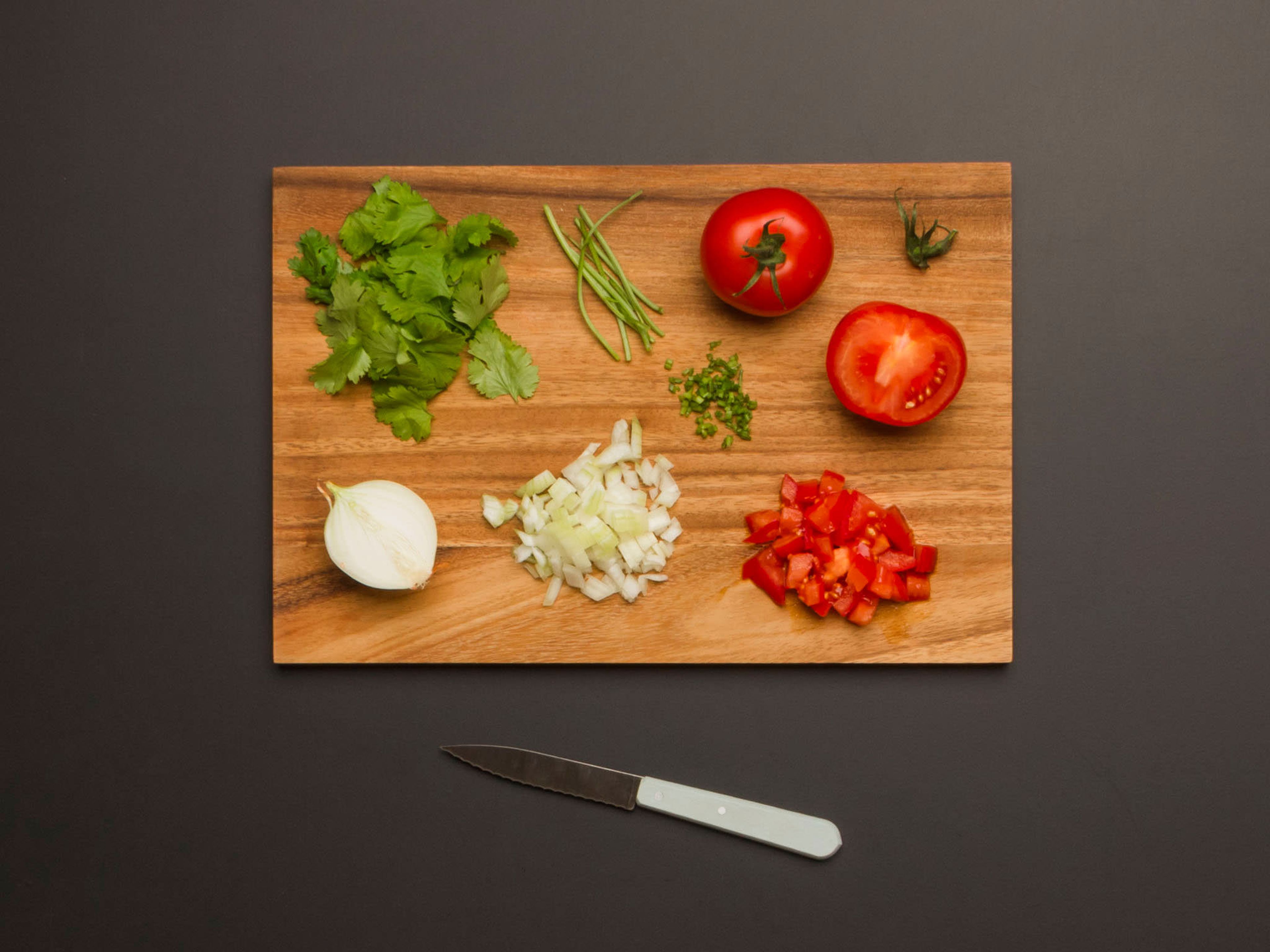 Cut tomatoes into small dices. Peel and finely dice onion. Pluck cilantro leaves from stem and finely dice stem.