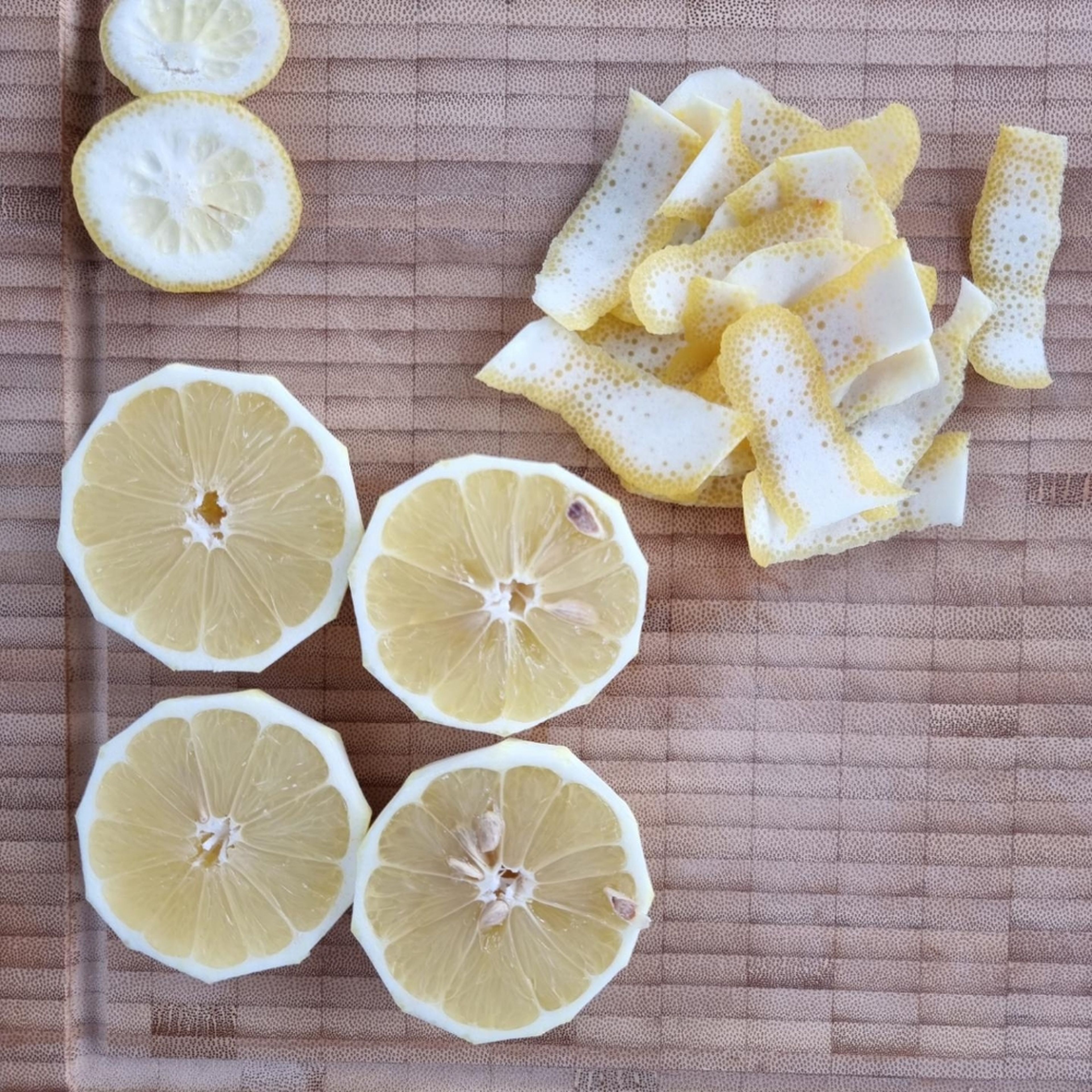 Cut the peel off of some of the lemons and finely grate the Parmesan cheese.