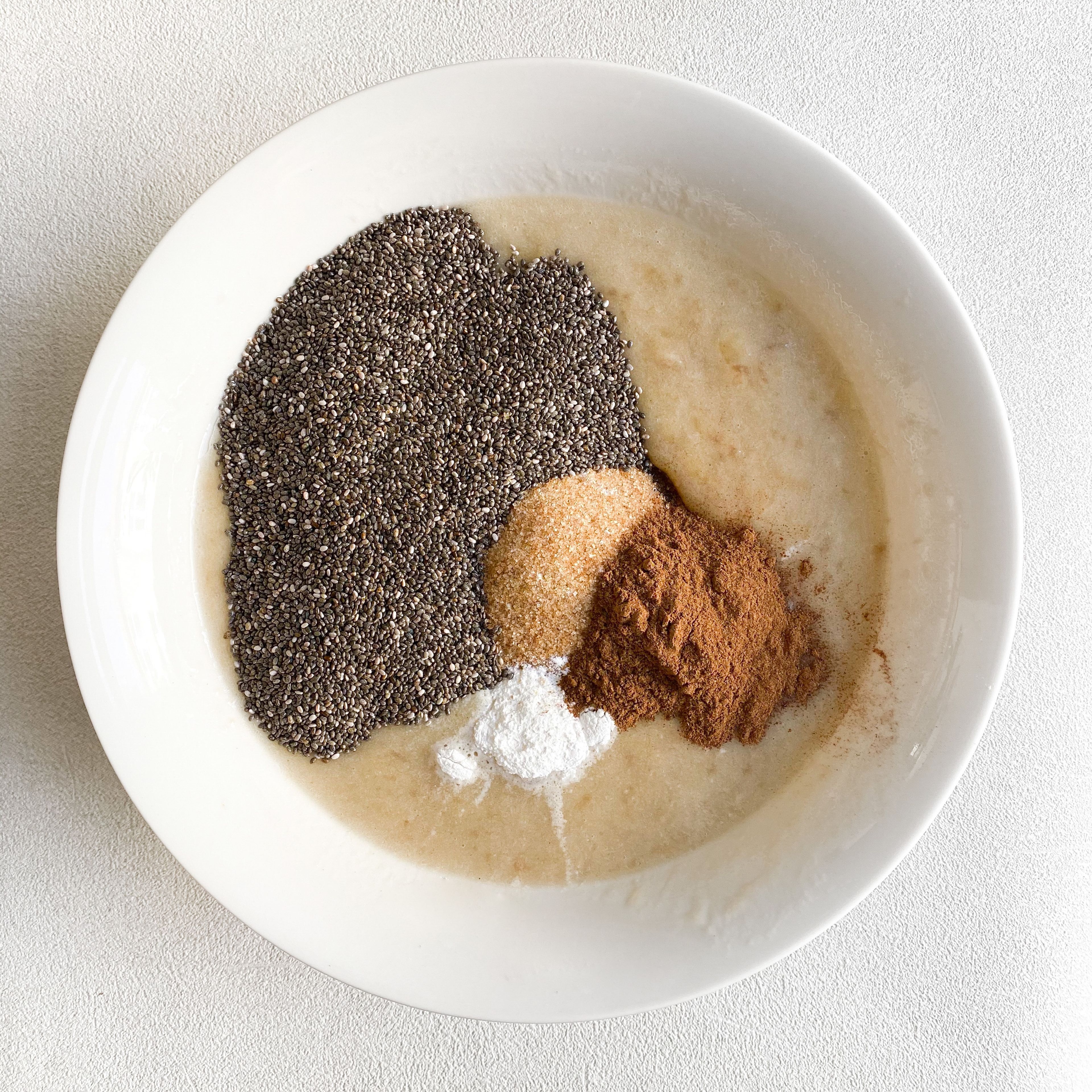 Add flour, chia seeds, cinnamon, brown sugar, salt, baking powder, and baking soda.