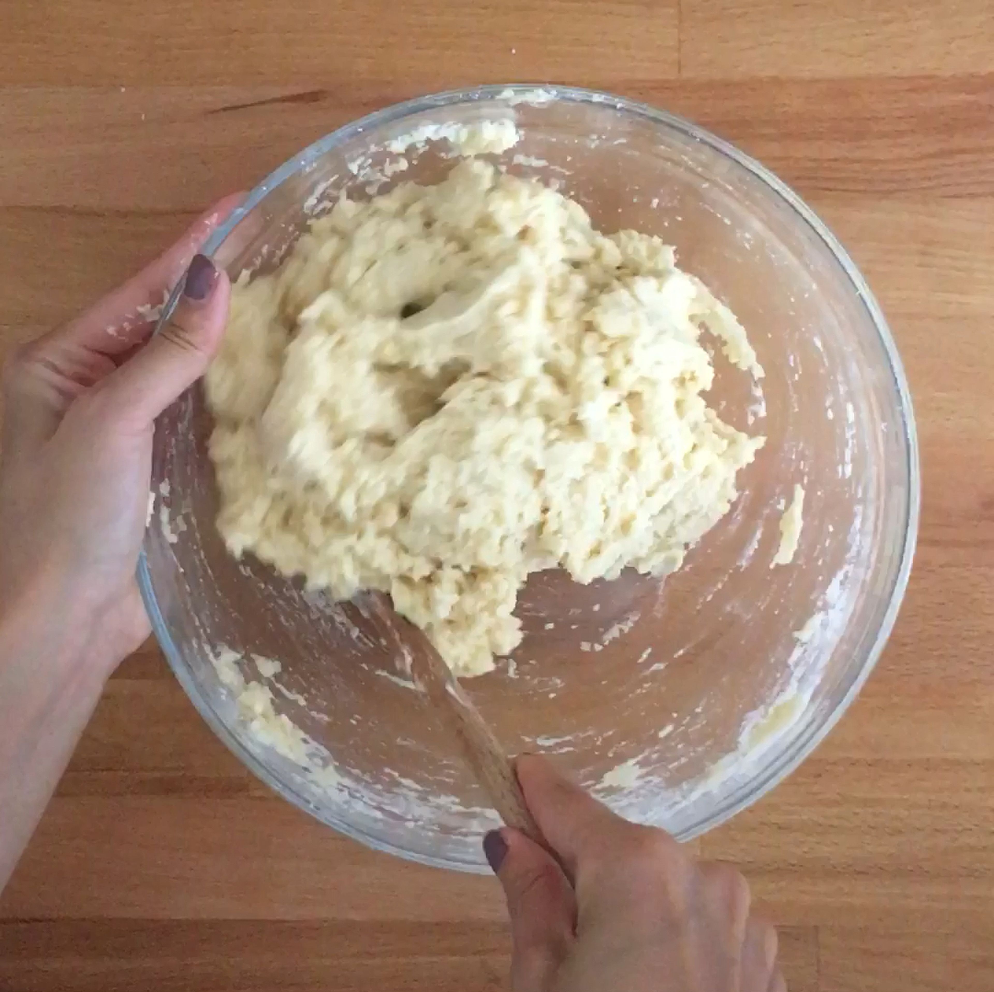 Create a well in the middle of the bowl, then add the buttermilk and vanilla extract. Stir with a wooden spoon, or use your hands, until a lumpy, sticky dough forms.