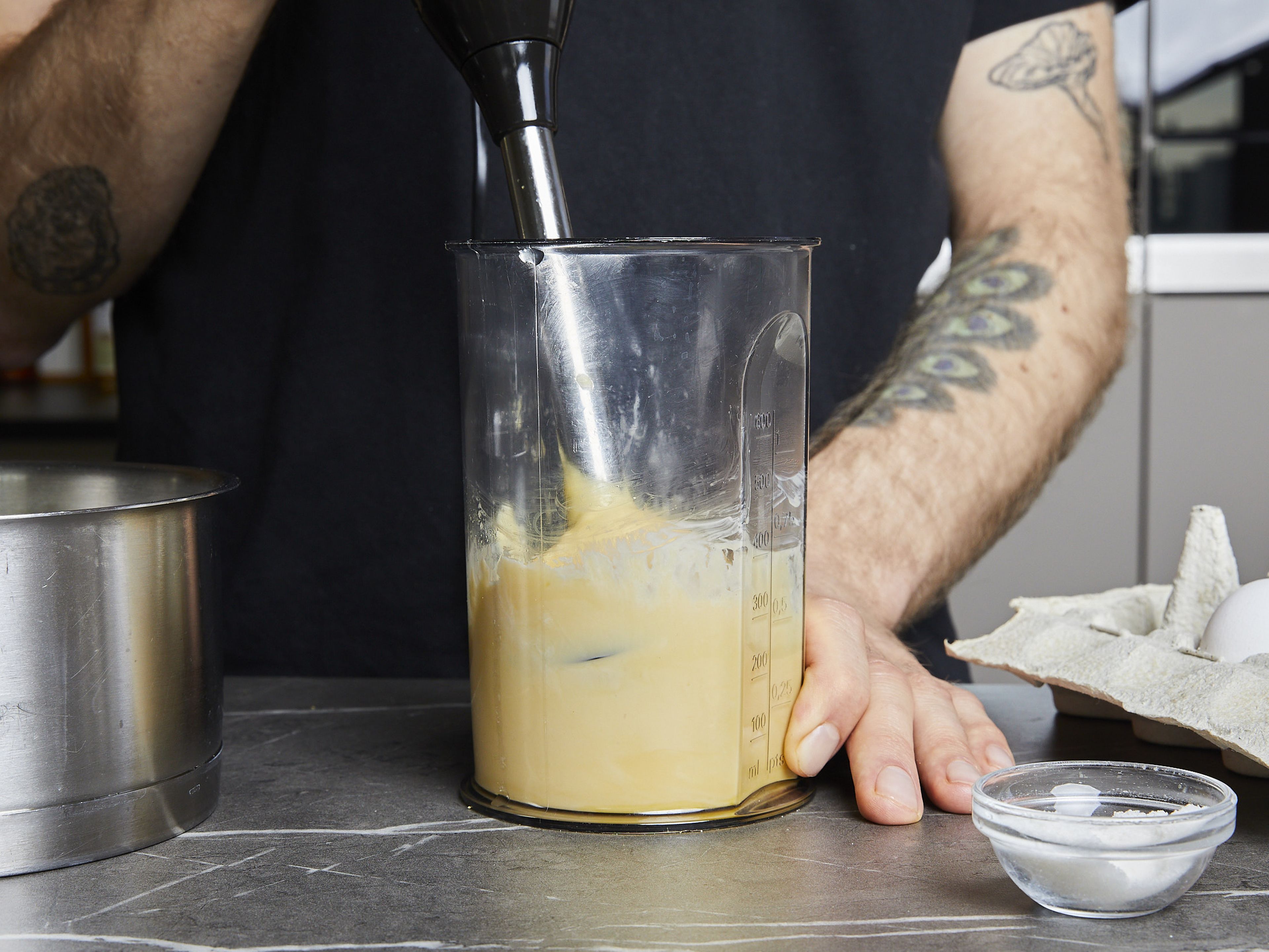To make the hollandaise sauce, start with melting the butter in a saucepan, being careful not to let it brown. Add egg yolks, lemon juice and salt to a cup that fits your immersion blender. With the blender running, slowly stream in the still-warm melted butter. Add a little water one tablespoon at a time to adjust the thickness to your liking. Keep warm until serving.