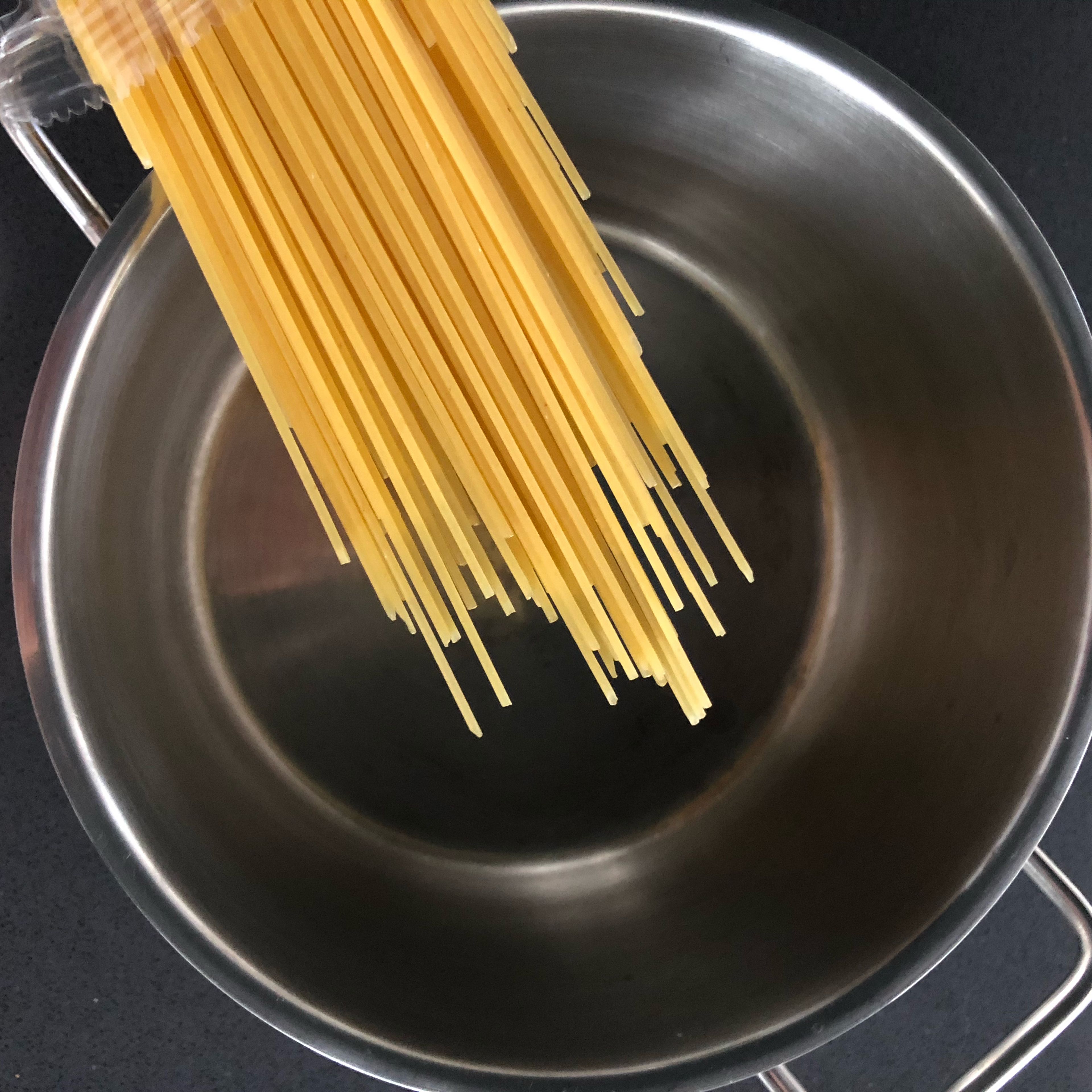 Fill the pot with water till it’s half full, add a pinch of salt and a little bit of olive oil and cook the spaghetti until done. (Use cooking instructions on packaging)