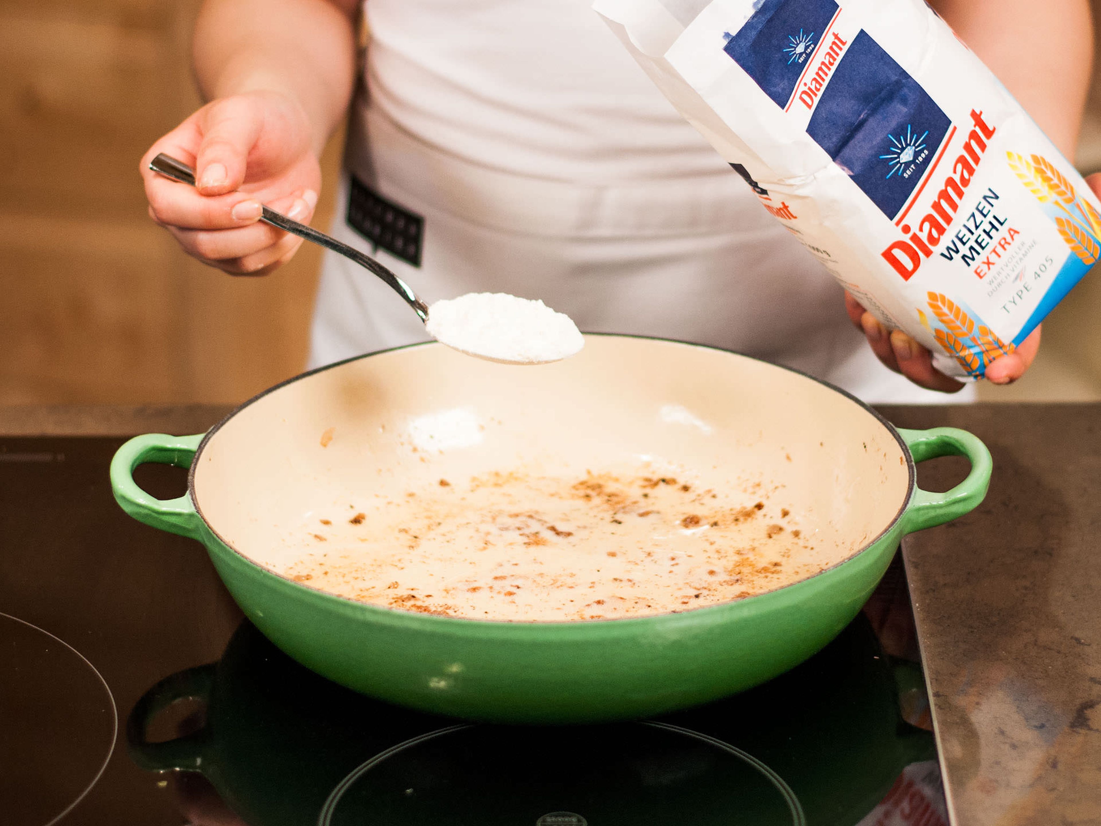 For the sauce, sauté flour in the remaining cooking oil and fill up with beef stock while stirring constantly.